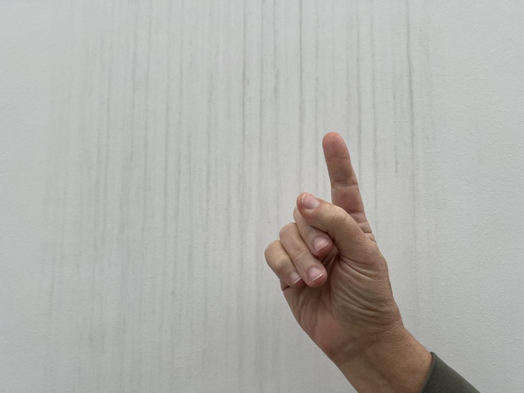 Testing wind direction with a wetted finger