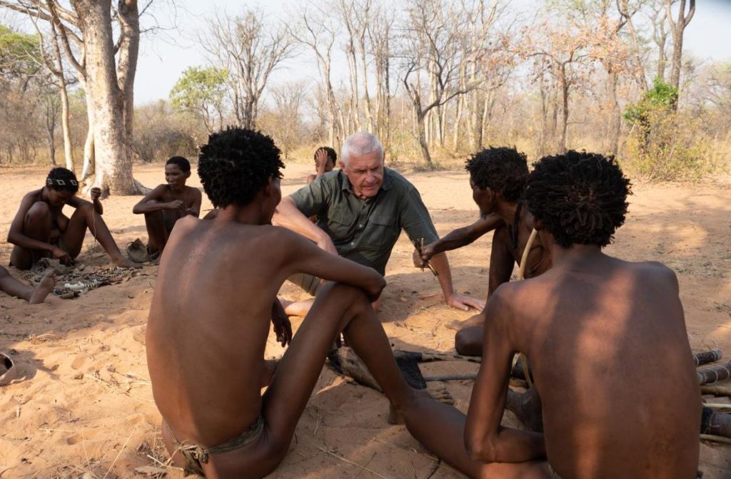Discussion with bushmen about the design of a hunting bow