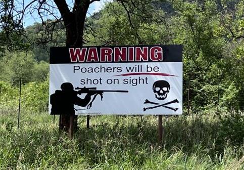 Warning sign for poachers on a private game farm at Limpopo province, South Africa