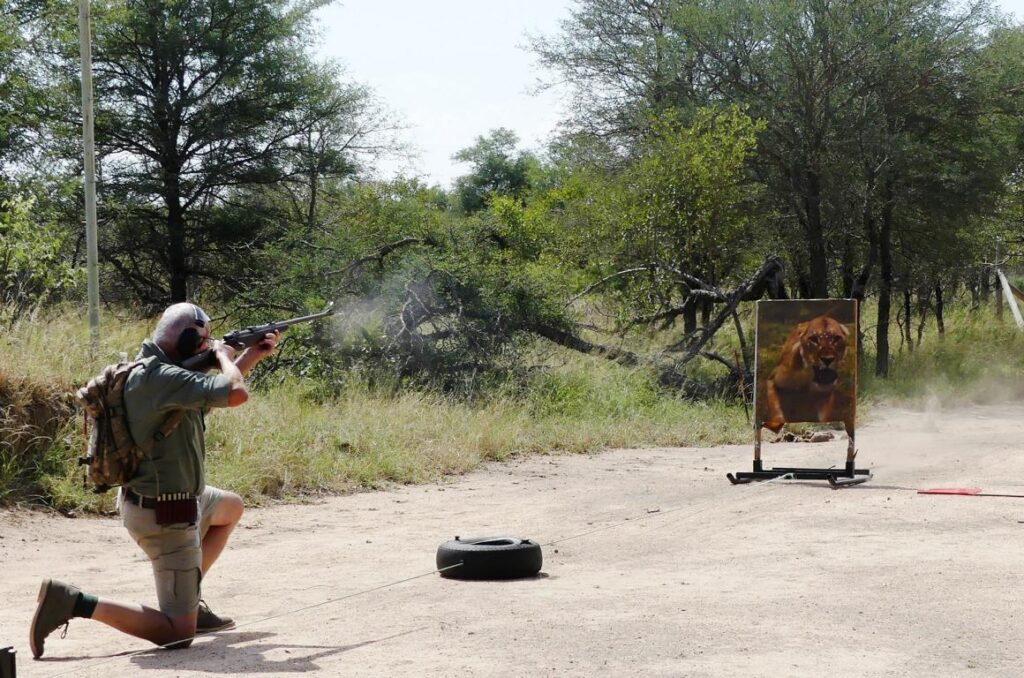 Kurt Hoelzl shooting a charging lion target at the advanced rifle handling examination