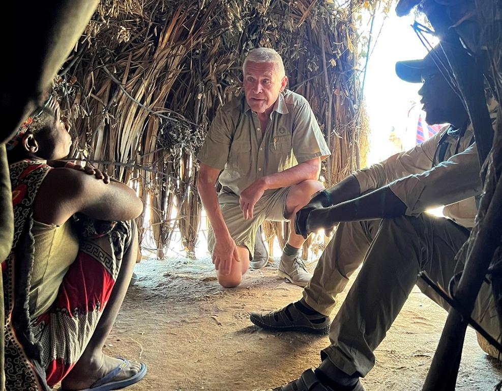 Kurt Hoelzl talking with a Hadza woman