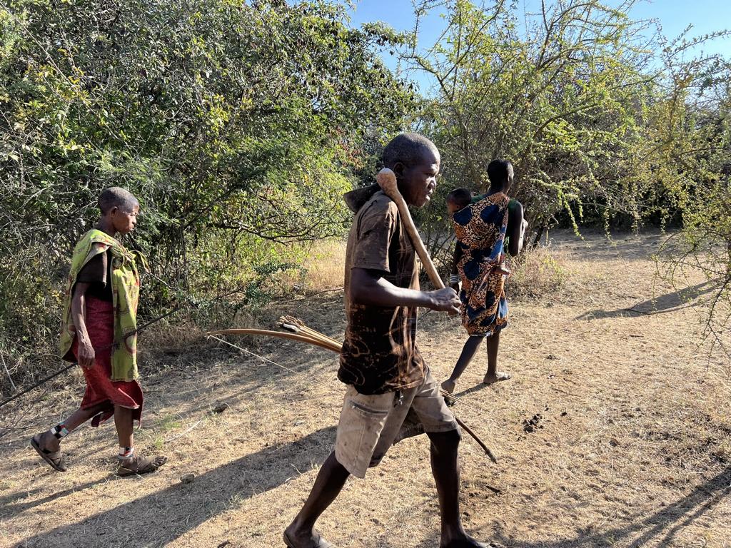 Hadza people heading into the bush foraging