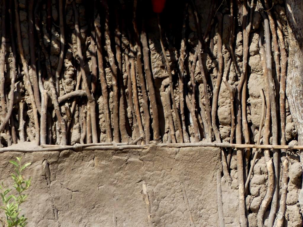 Eroded wall of a Datoga hut plastered outside with mud