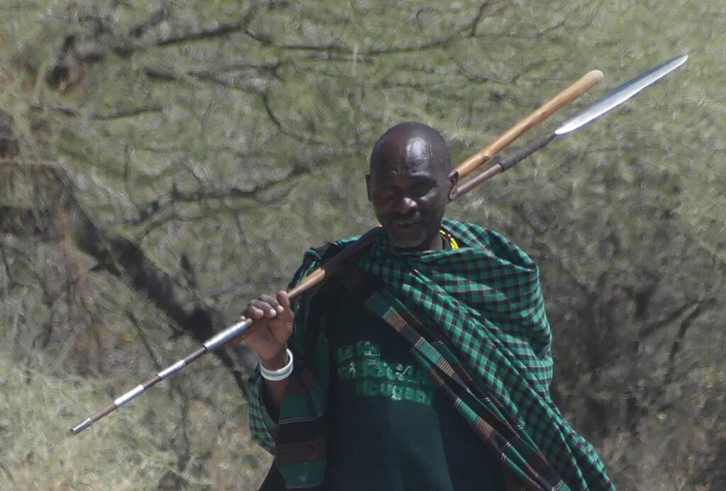 Datoga warrior with his spear and herding stick