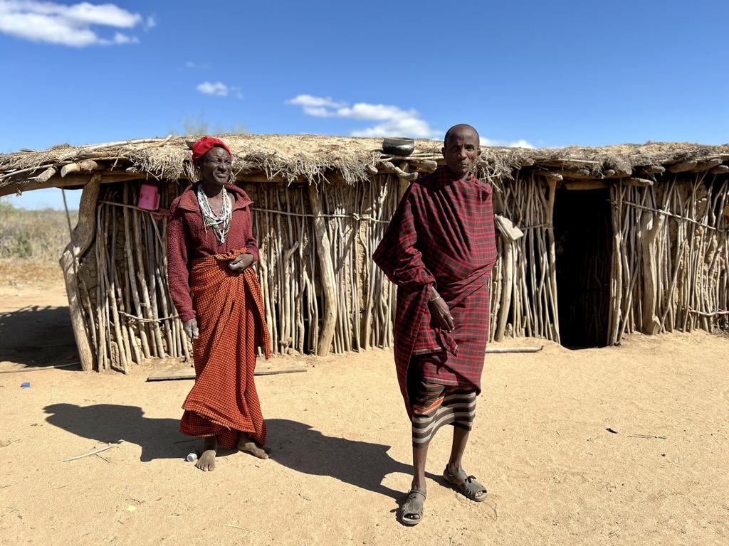 Two Datoga headmen in front of their huts