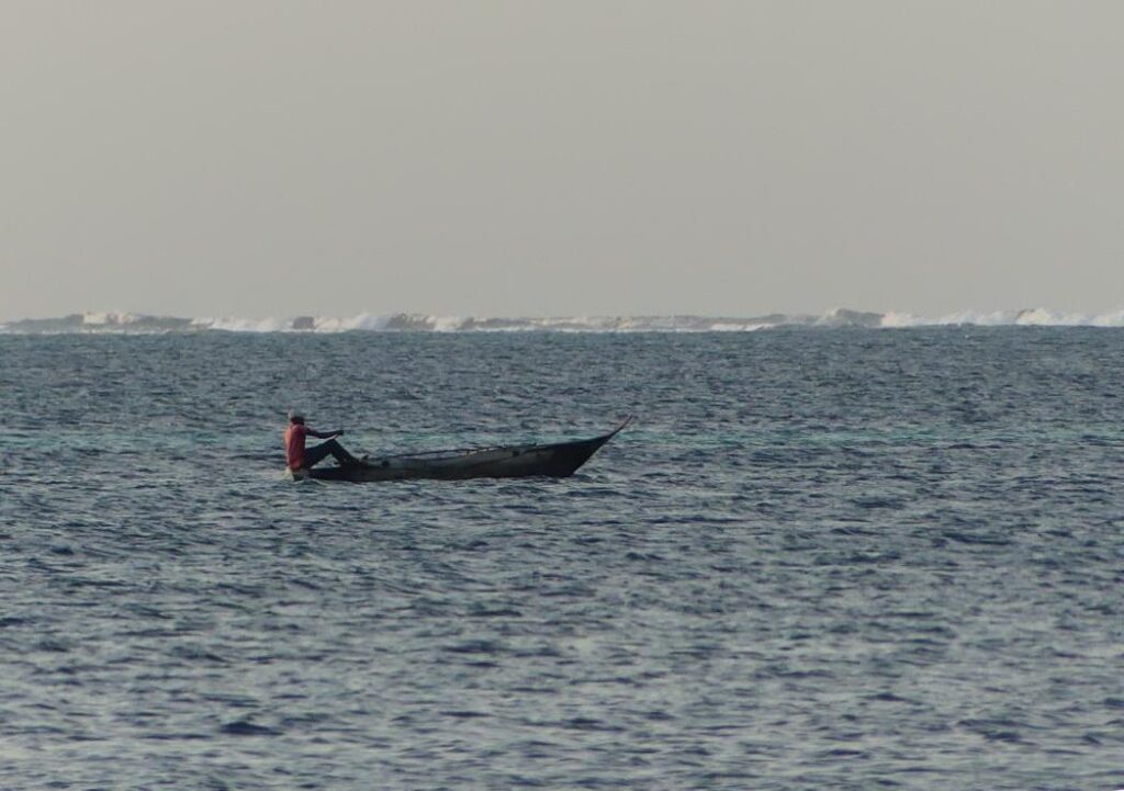 Fisherman on Ngalawa boat at Zanzibar