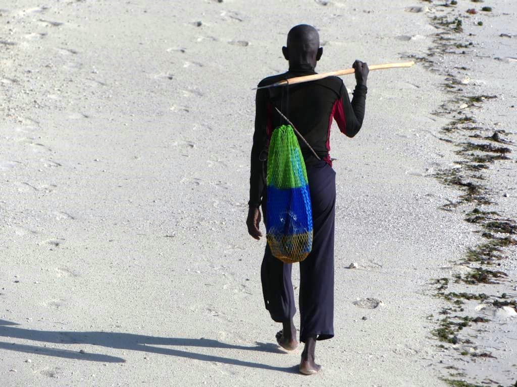 Male coastal forager with spear at Zanzibar