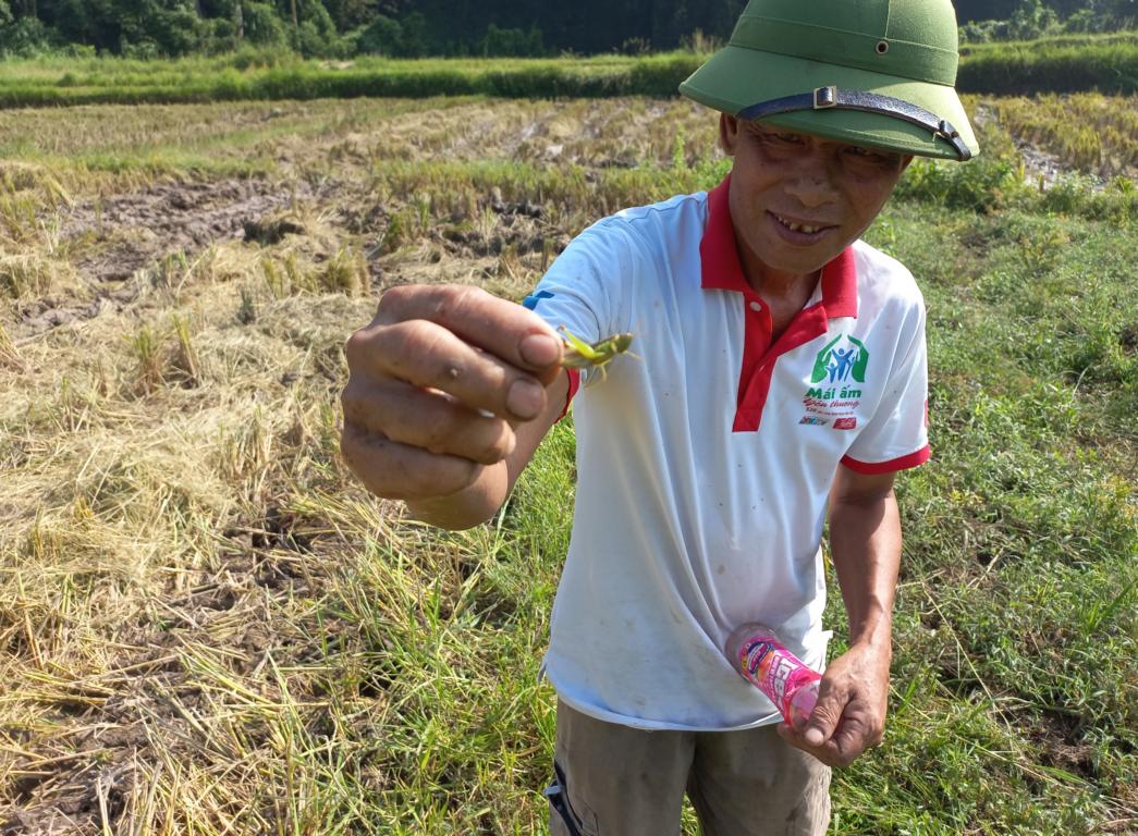 A North Vietnamese rice farmer with one of his protein sources