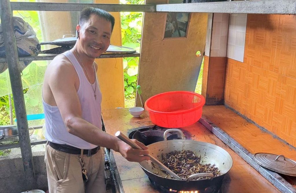 Dan is stir-frying the delicacy