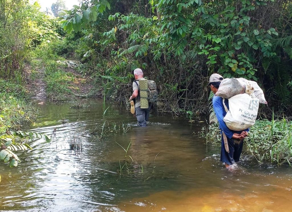 Walking in waterlogged areas of Indonesias Jambi province