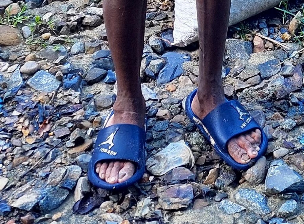 Plastic sandals as jungle footwear