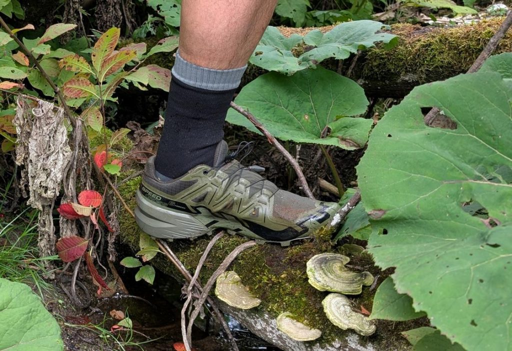 Combination of waterproof socks and trail running sneakers