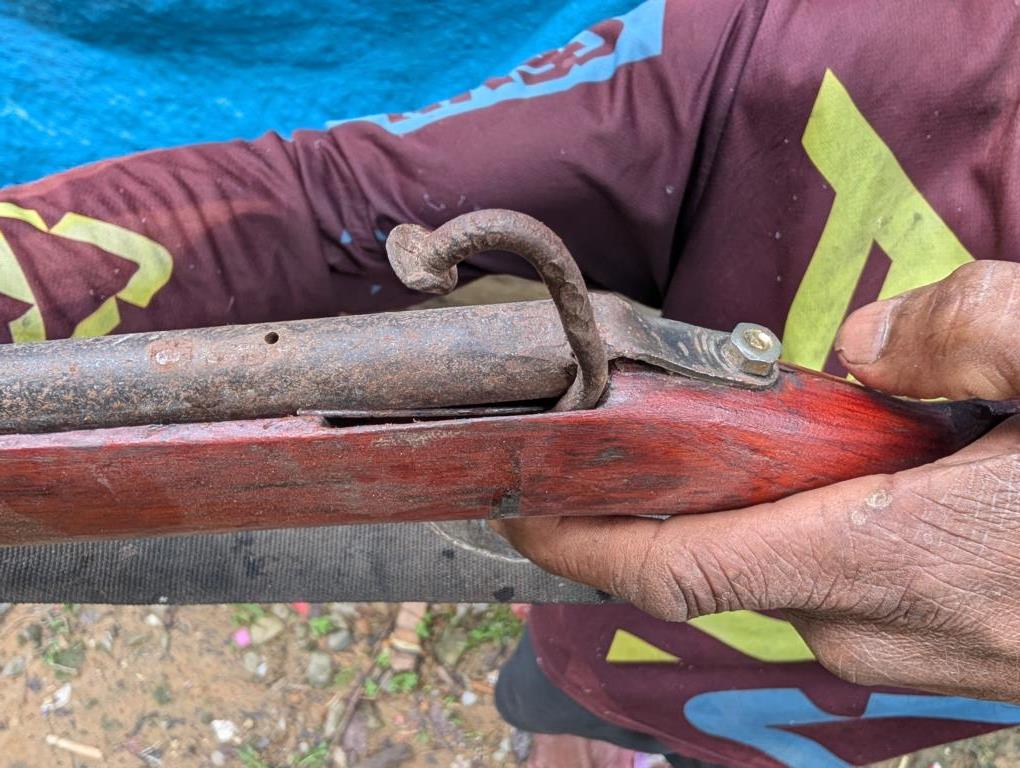 Using a nail as a hammer for a percussion lock