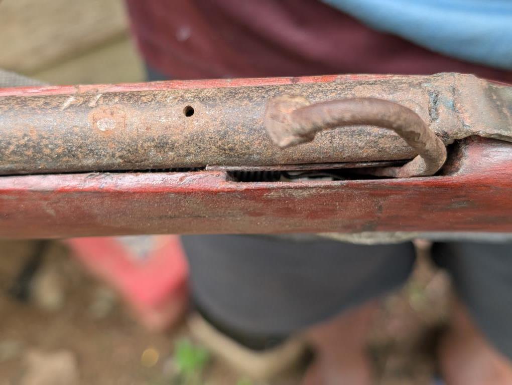 Detailed view of the firing spring in a percussion lock system