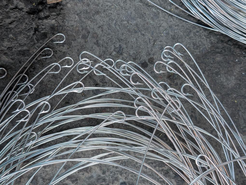 Stainless steel wire sections with fishing hooks on their ends