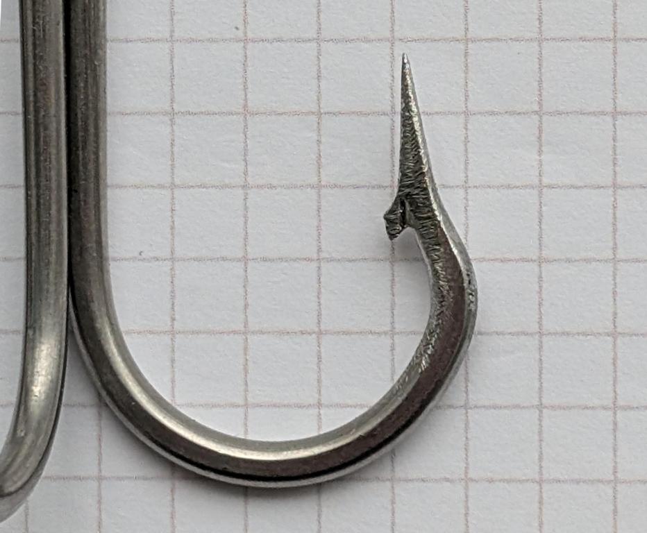 Spear tip with barb of a treble fishing hook