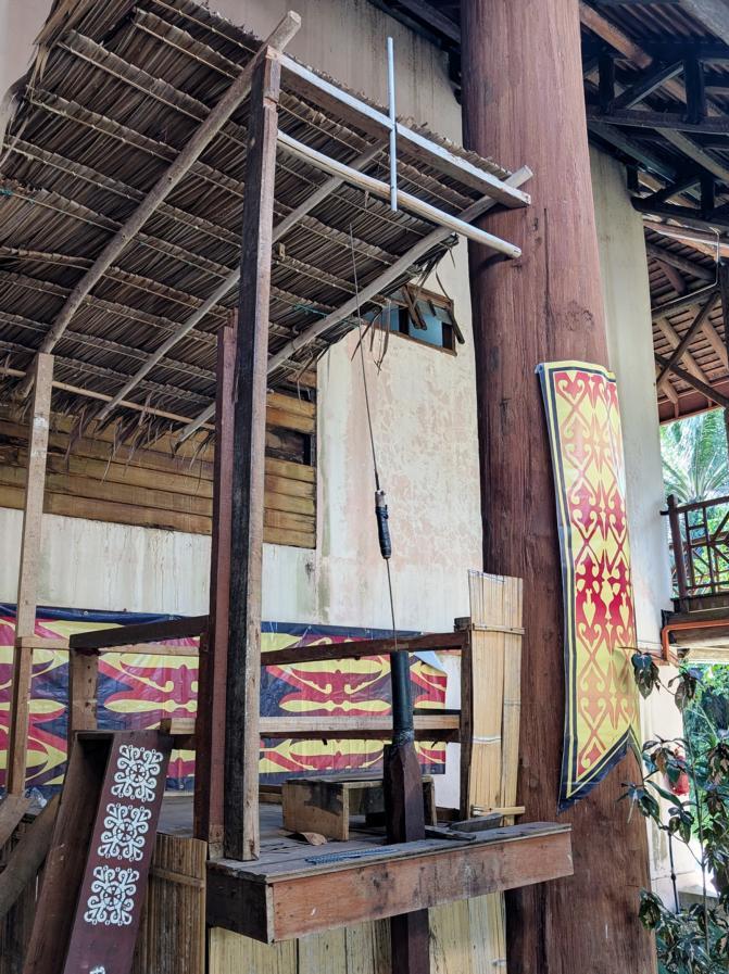 Scaffold of Murut people for drilling the blowpipe barrels